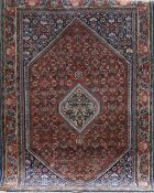 Teppich, rotgrundig mit floralem Muster und Zentralmedaillon, Kanten belaufen, 165x113 cm
