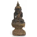 Buddha, um 1900, Holz, plastisch geschnitzt und partiell vergoldet, auf Podest sitzend, H. 56 cm