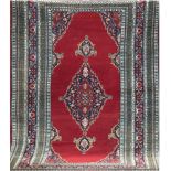 Teppich, Pakistan, 200x132 cm, rotgrundig mit zentralem Medaillon u. Floralmotiv, Fransen gekürzt,