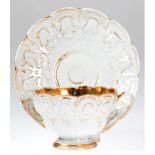Meissen-Tasse mit UT und Glasteller, 18. Jh., Reliefdekor, breiter Goldrand innen und Goldstaffage,