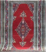 Teppich, Pakistan, 200x132 cm, rotgrundig mit zentralem Medaillon u. Floralmotiv, Fransen gekürzt, 