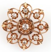 Brosche/Anhänger um 1900, 585er RG (geprüft), filigrane, gestufte Blütenform, besetzt mit 9 Diamant