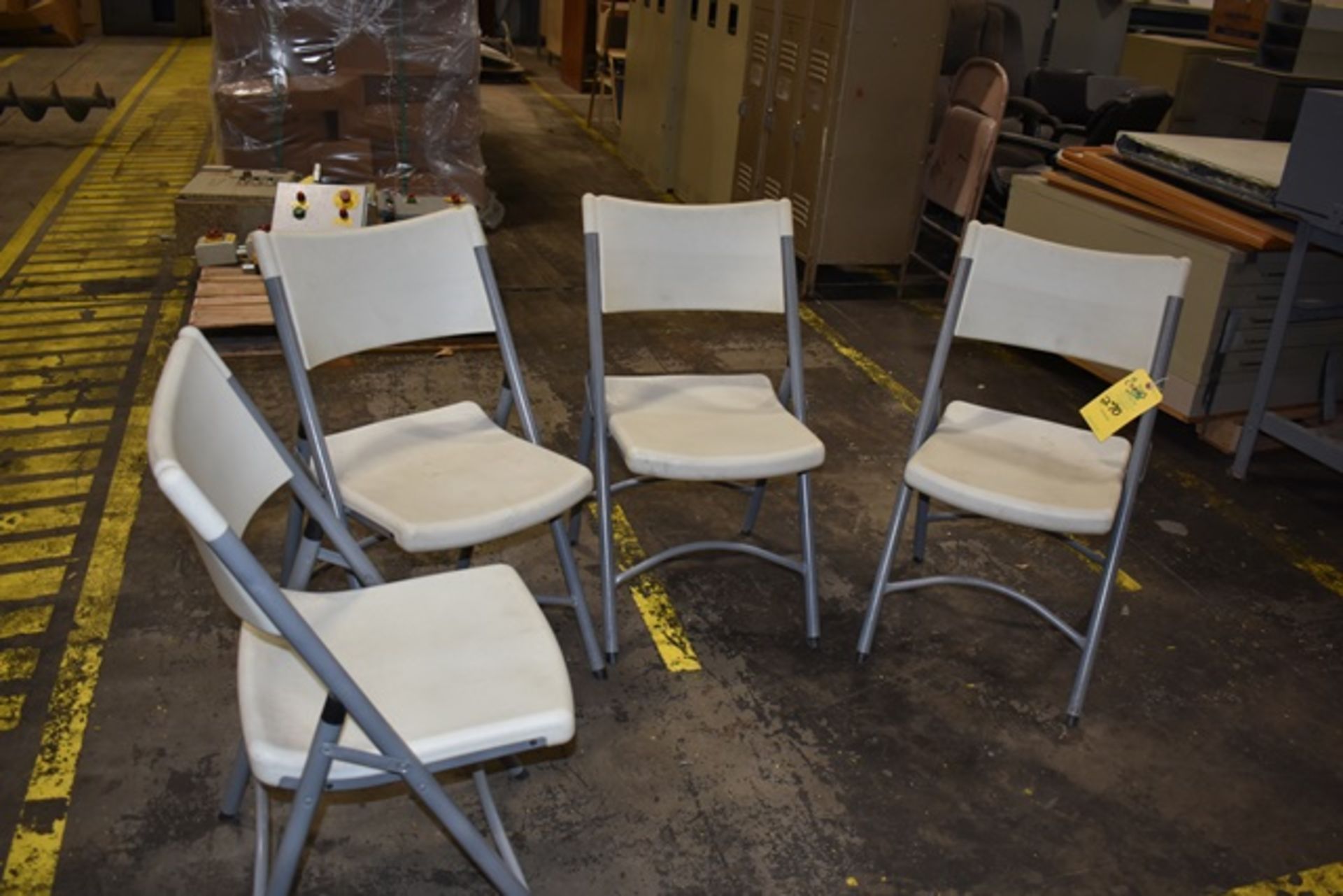 Qty. (4) Poly Folding Chairs, Rigging Fee: $70