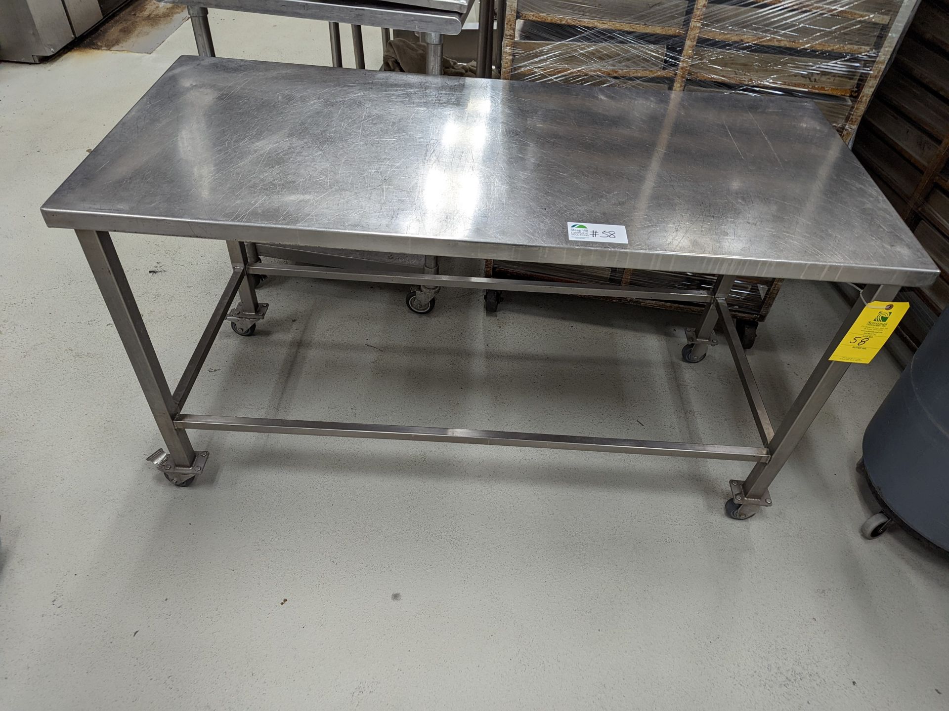 Stainless Table on castor wheels, 60Lx27Wx34H