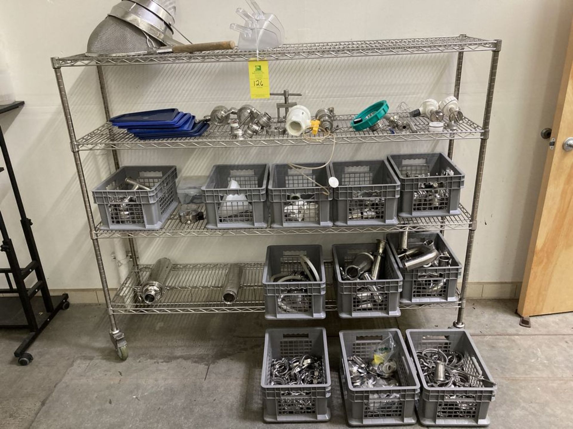 LOT OF MISC, tri-clamps, valves, measuring containers, shelf unit. ***Rigging and Loading Fee of $