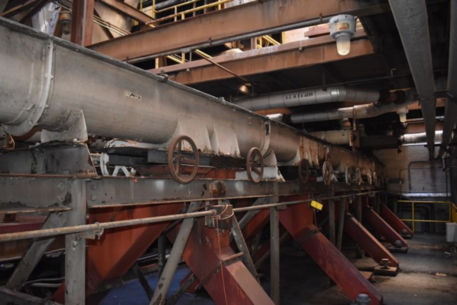 (2) Feed Screw Conveyors, approx 55-L x 12"dia, carbon steel through with gear drives, associat