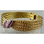 Armband in Schleifenform 750 Gelbgold mit 10 Rubinen und 5 Brillanten.