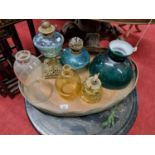 A quantity of Oil Lamps and Shades along with a large Copper oval Tray.