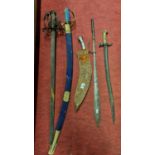 A 19th/20th Century Bayonet along with a group of swords and a kukri.