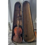 An old Violin and case in poor condition. 58cms long approx.