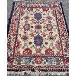 A nice cream Rug with navy border and red and blue design. 240 x 168 cm approx.