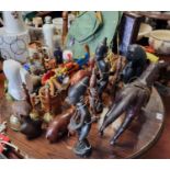 A collection of Wooden Figures and Items and some Holiday Memorabilia including Boomerangs and a