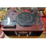 A Teac Record Player and Recorder along with an as new four time zone Clock, both working
