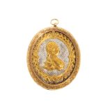 18kt gold cameo medallion pendant.The cameo depicts the image of a woman in profile with