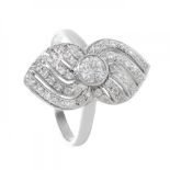 18K white gold shuttle ring with brilliant pavé.Sinuous frontis with central brilliant of 0,40cts.