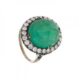 Oval emerald and brilliant ring in 18kt yellow gold with silver settings. Estimated diamond weight