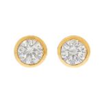 Pair of 18k yellow gold sleepers earrings. With central brilliant-cut diamonds, J colour, SI3 purity