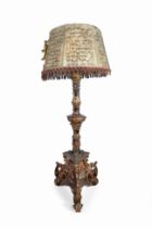 Axeman type floor lamp. Spanish or Italian, 17th century.Carved, polychromed and gilded wood.