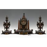 Fittings with Egyptian motifs, late 19th century.Bronze.Measurements: 50 cm. height clock; 44 cm.