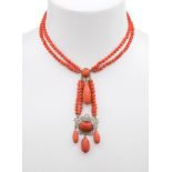 Coral necklace S.XIX. Formed by three bodies of irregular balls of 4.4 mm in diameter.Adorned with