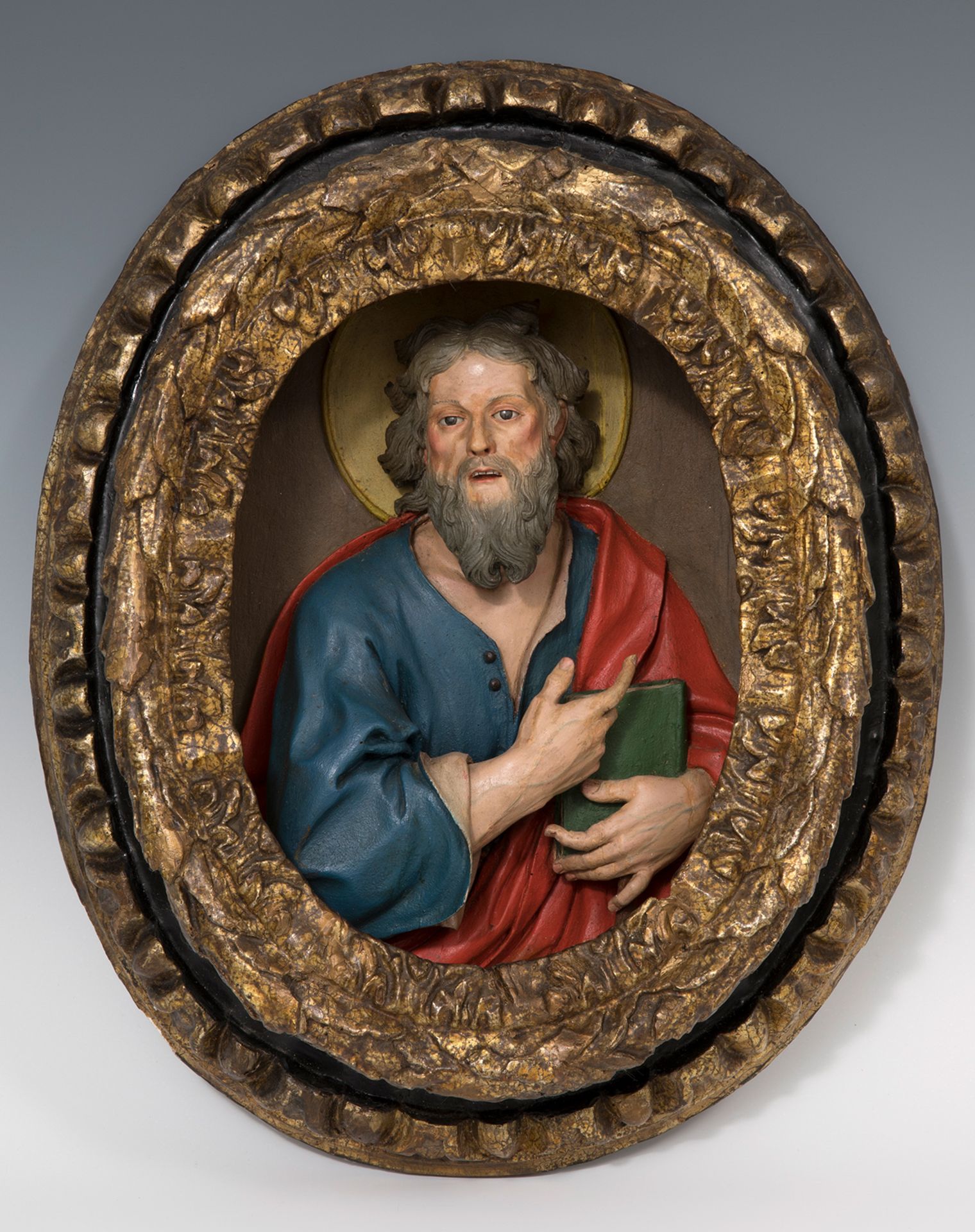 Italian school, 17th century."Saint Matthew".High relief in carved and polychrome wood. Vitreous