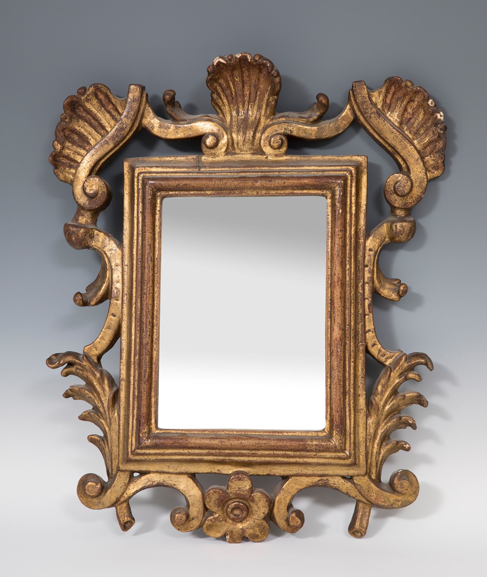 Carlos III cornucopia type mirror. Spain, mid 18th century.Carved and gilded wood.Damaged.