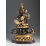 Tibetan Buddha, 19th century.Bronze and gilded bronze.Measurements: 31,5 x 19 x 10 cm.Gautama