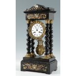 Napoleon III table clock; France, circa 1860.Ebonised wood, bronze and metal and mother-of-pearl