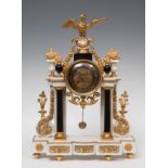 Louis XVI style portico clock; late 19th century.Gilded bronze and marble.Key preserved.