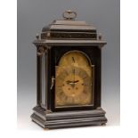 Bracket type table clock, late 17th-early 18th century.Box with wooden latticework and gilt brass