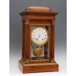 Charles X Portico Clock. France, ca.1830.Case of amboine root, with bronze appliques.Porcelain