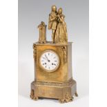 Table clock; France, c.1840.Gilt bronze.Measurements: 49 x 24 x 15 cm.Table clock made of gilded
