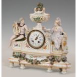 Table clock, Louis XVI style; Germany, XIX century.Porcelain.There are faults in the porcelain.No