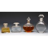 Four Art Deco perfume bottles. France ca. 1940. Moulded glass.Provenance: Spanish private