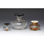 Three bottles of CARON fragrances. France, ca. 1940."Le Narcise Noir and Le Narcise Blanc.Moulded