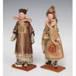 Pair of Japanese figures; 18th century.Earthenware and canvas.The male figure's hands are missing.