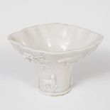 Libation cup; Dehua, China, 18th century.Blanc de chine porcelain.It presents pitting and faults