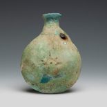 Egyptian faience flask. 4th-3rd century BC.Painted faience.Measurements: 15.5 x 12 x 5 cm .
