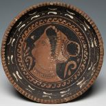 Dish. Apulia. Magna Graecia, 4th BC.Polychrome ceramic with black glaze.Attached is a report