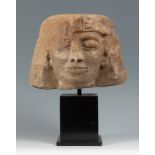 Pharaoh's head from an Egyptian royal statue, ca. 3323 BC.Granite stone.There are losses on the