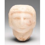 Roman head, 2nd-4th century AD.Marble.Measurements: 6.5 x 5 x 6.5 cm.Roman figure in round marble
