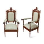 Pair of two armchairs, friar armchair style; Spain, early 20th century.Carved oak or walnut wood and