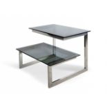 Design coffee table, 70's.Chromed metal and glass.Measurements: 51 x 60 x 60 cm.Structure of