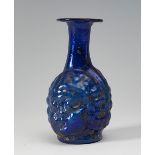 Flask with the head of Janus. Ancient Rome, 200 AD.Blue glass.In good condition.Provenance: Acquired