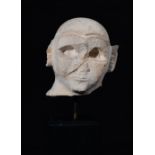 Male head. Sumerian, Early Dynastic IIIb period, ca. 2500-2250 BC.Limestone.Repaired from two