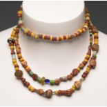 Set of three necklaces. Rome, I-II centuries AD.Stones, glass and ceramics.Attached is a report