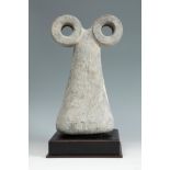 Oculate idol. Tell Brak, Mesopotamia, ca. 3500-3000 BC.Grey stone.Provenance: Liquidation of the