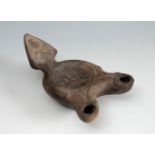 Roman Lucerne. Roman culture, 2nd-3rd century AD.Terracotta.Restoration on the handle.Provenance.