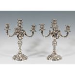 Pair of candlesticks, early 20th century.Silver.Measures: 45 x 30 cmWeight: 1,966 kg each.Pair of