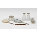 Elegant and complete silver and crystal dressing table set. Composed of seven pieces, two perfume